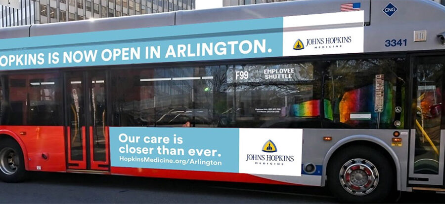 Bus wrapped with Hopkins NoVa campaign creative